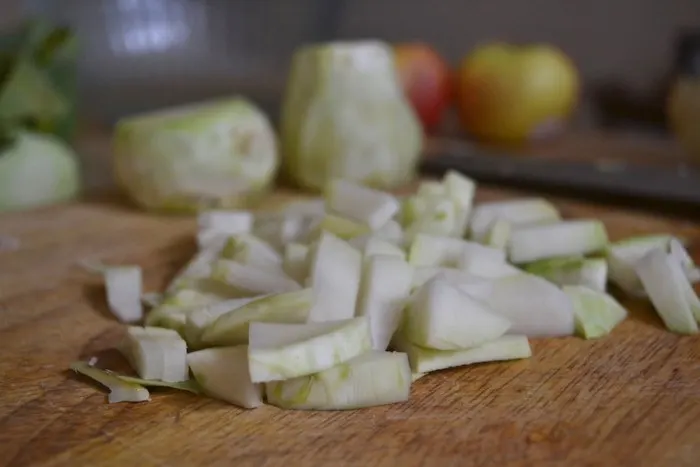 Diced Apples and Kohlrabi are slicked in a savory dressing for a refreshing Kohrabi Slaw. Full recipe on BigTasteTinySpace.com