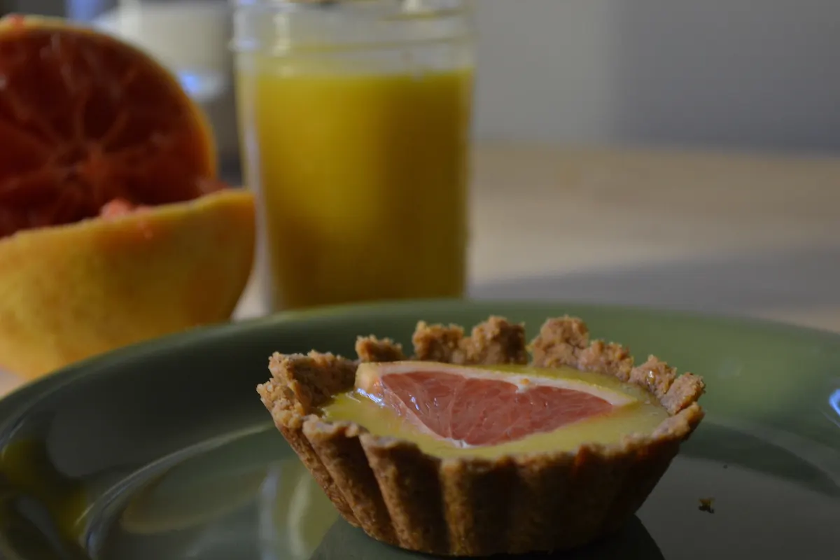 Top tart shells with grapefruit curd. Full recipe on BigTasteTinySpace.com
