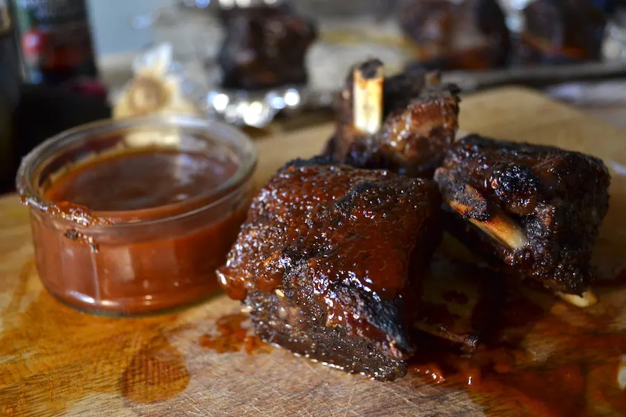 Pomegranate Ribs Slathered with BBQ Sauce. Full recipe on BigTasteTinySpace.com
